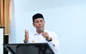 Bupati Aceh Besar Muharram Idris menyampaikan sambutan